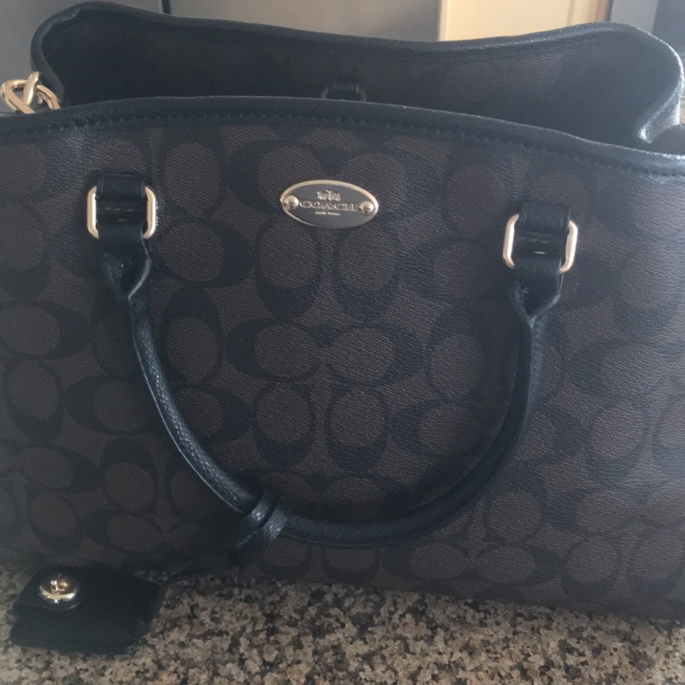 Coach Handbag with shoulder strap.